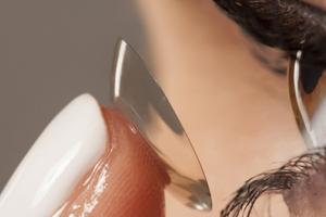 A woman applying contact lenses.