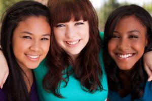 A group of smiling teenagers.