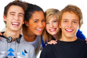 A group of smiling teenagers.