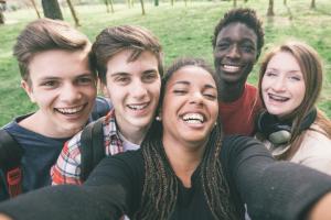 A group of smiling teenagers.