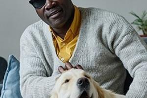 Visually impaired man with his dog.