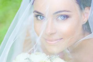 A bride smiling.