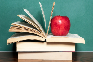 book stack with apple