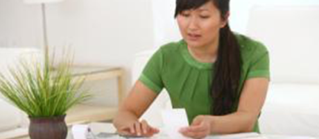 woman looking at receipts