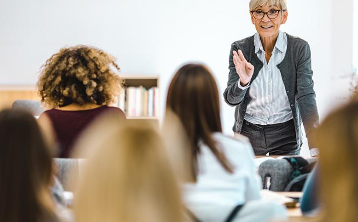 Professor in discussion with class.